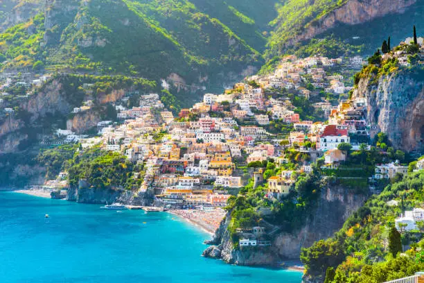 Morning view of Positano cityscape on coast line of mediterranean sea, Italy