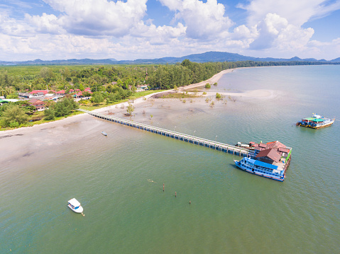 Aerial view shot tropical beach sea with long tail boat in south thailand