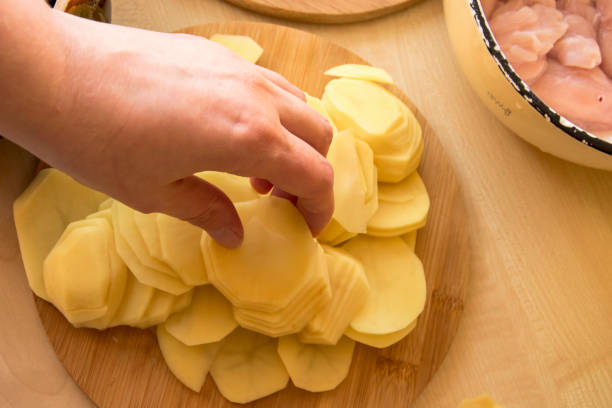 istock sliced potatoes on board ingredients for cooking 991221034
