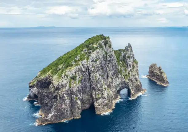 An aerial view of Piercy Island, in New Zealand's Bay of Islands area, located at the north of the country's North Island, with the iconic Hole in The Rock cave.