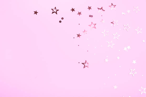 istock Golden stars on pink background 991244534
