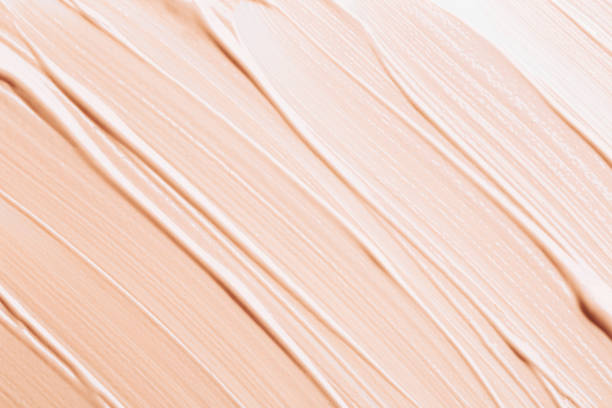 background made of liquid foundation - make up brush imagens e fotografias de stock