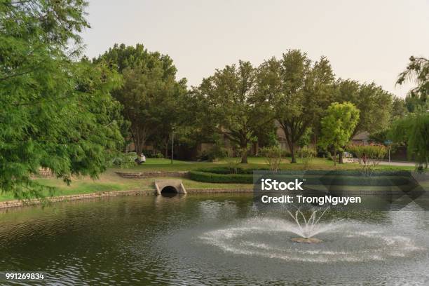 Community Lake With Outfall Sewer In America Stock Photo - Download Image Now - Texas, Blue, Car