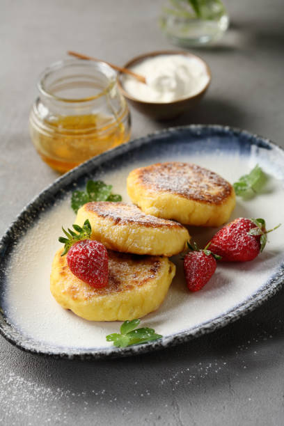 istock Breakfast pancakes with cream, food close-up 991281824