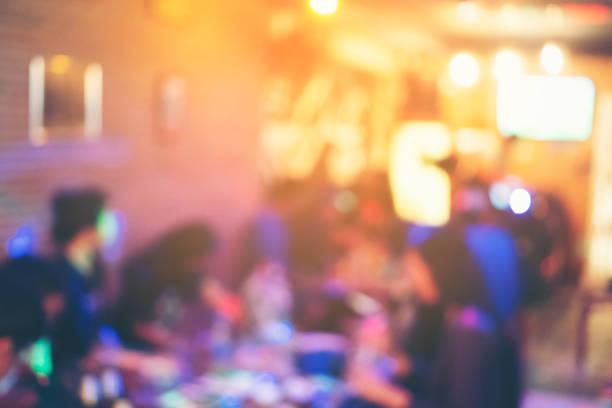 istock abstract blurry background of people party at night 991282300