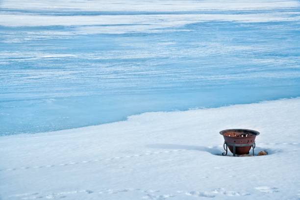 Surface of a frozen lake shining in glacier color, retouched and color manipulated texture.