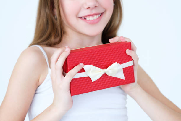 istock girl hold present gift box reward surprise parents 991344114