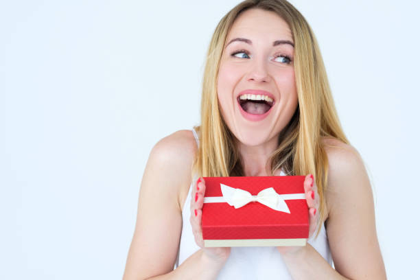 istock thrilled excited woman gift box surprise present 991344280