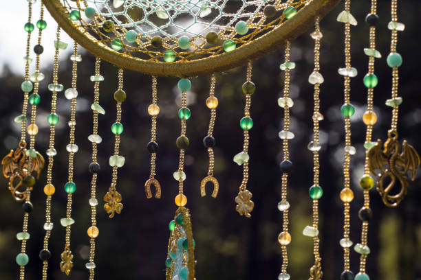 istock Handmade dream catcher with feathers threads and beads rope hanging 991355418