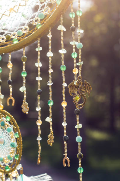 istock Handmade dream catcher with feathers threads and beads rope hanging 991355424