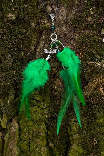 istock Handmade dream catcher with feathers threads and beads rope hanging 991360500