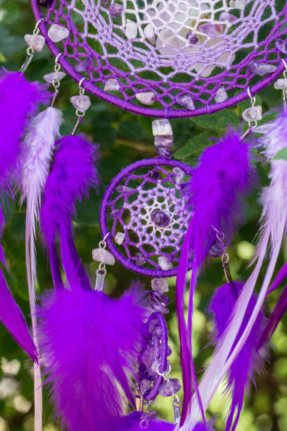 istock Handmade dream catcher with feathers threads and beads rope hanging 991361030