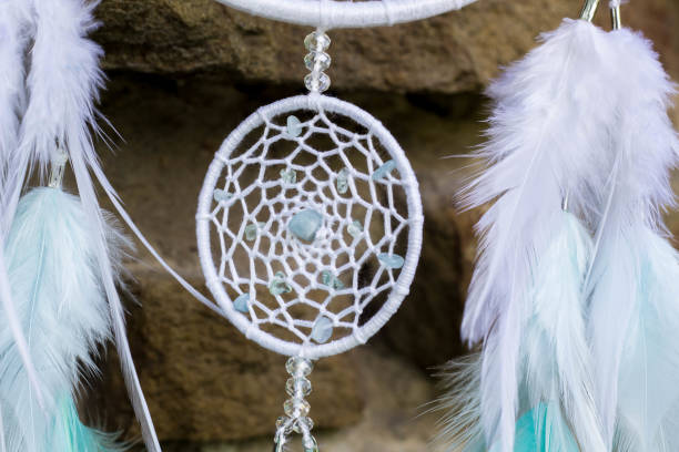 istock Handmade dream catcher with feathers threads and beads rope hanging 991361066