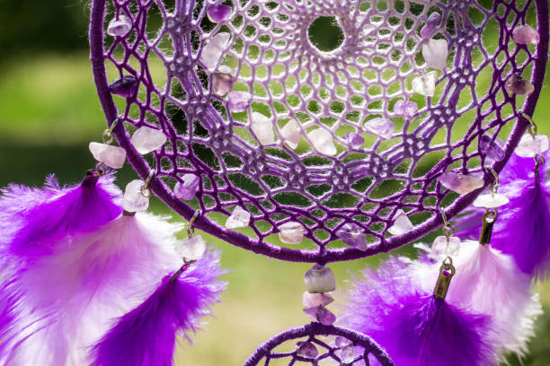 istock Handmade dream catcher with feathers threads and beads rope hanging 991361084