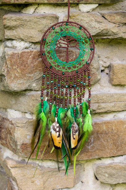 istock Handmade dream catcher with feathers threads and beads rope hanging 991361170