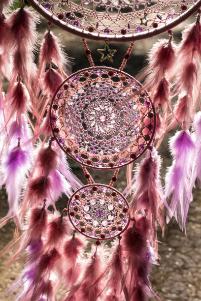 istock Handmade dream catcher with feathers threads and beads rope hanging 991361342