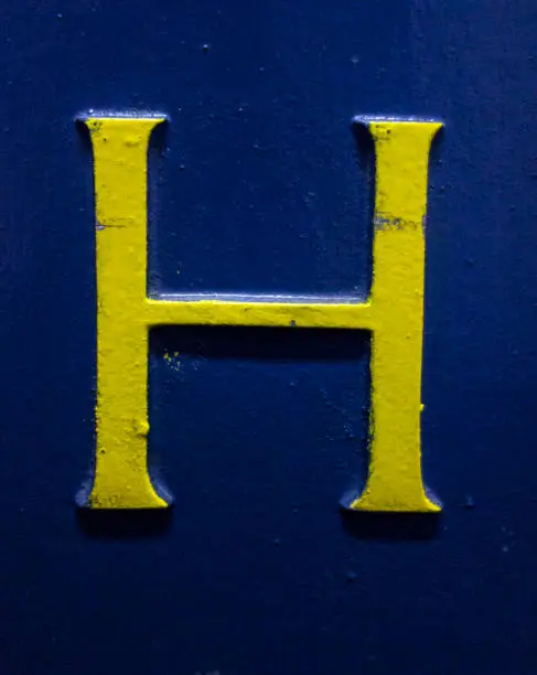 Photo of Written Wording in Distressed State Typography Found Letter H