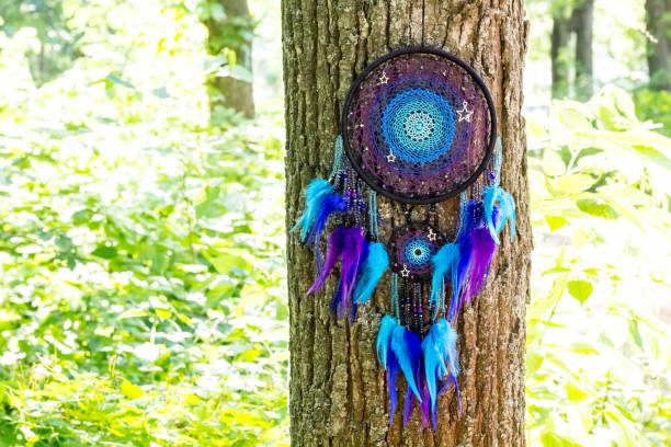 istock Handmade dream catcher with feathers threads and beads rope hanging 991361482