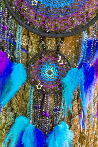 istock Handmade dream catcher with feathers threads and beads rope hanging 991361658