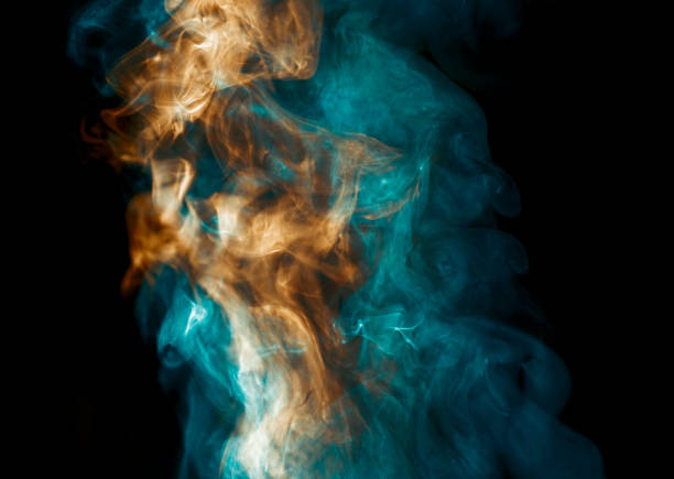 Orange and Teal Coloured Steam on Black Background