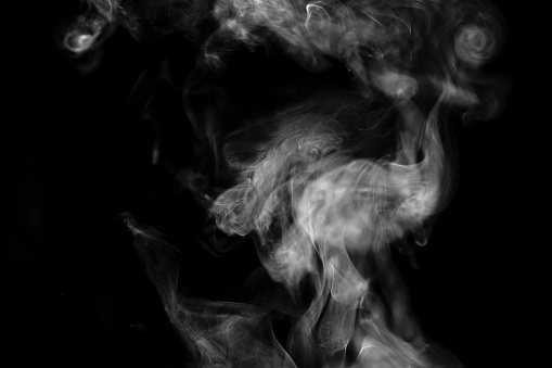 Real studio shot hot steam against a black background.