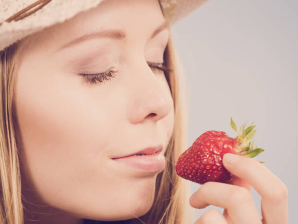 istock Young woman with fresh strawberry 991368070
