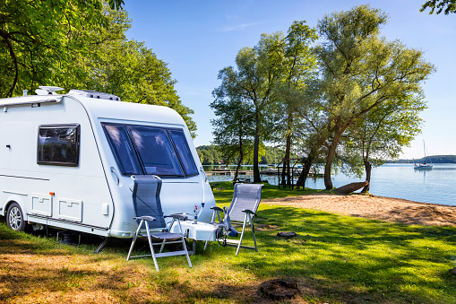 Vacations in Poland - Camper trailer on the shore of bay of the Drawsko lake