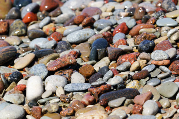 istock Beautiful colorful rocks on beach 991374658