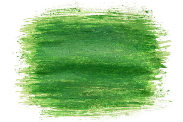 Photo of hand drawn paintbrush green watercolor brush stroke painting isolated on white