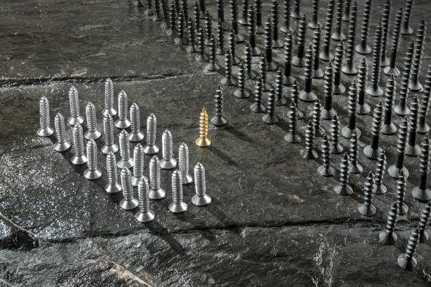 istock Unequal battle of screws 991378774