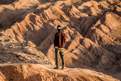 Man standing at Valle de la Luna (Moon Valley), Atacama desert. Chile