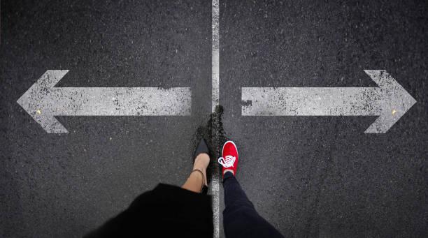 istock Red canvas and dress shoes standing next to right and wrong painted text 991383974