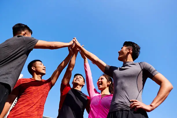 young athlete putting hands together young athlete putting hands together