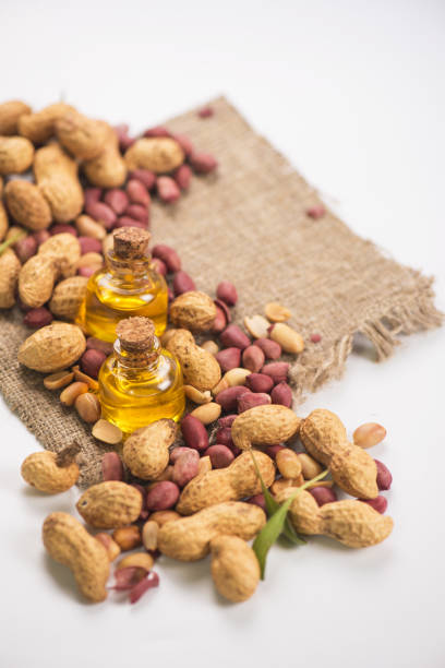 istock Natural peanut with oil in a glass 991390834