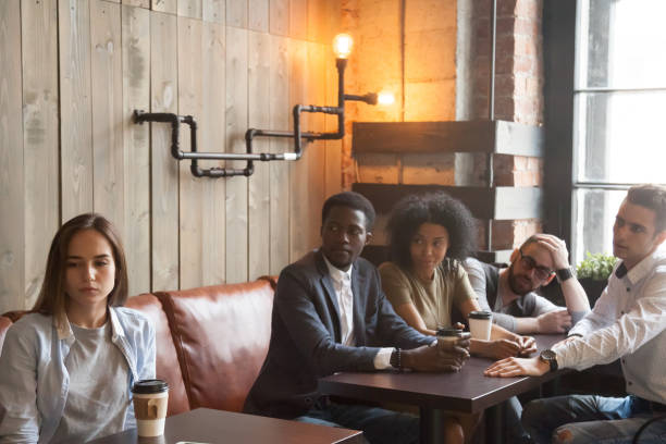 istock Upset rejected girl ignoring people cheering her in cafe 991406896