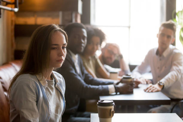 istock Offended girl ignoring friends apologizing after bad joke 991406926
