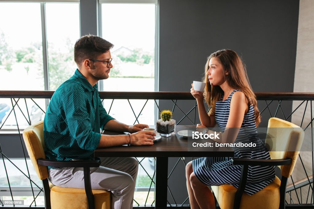 Maybe it's time for a breakup Shot of a couple having a conversation over coffee at the restaurant Discussion Stock Photo