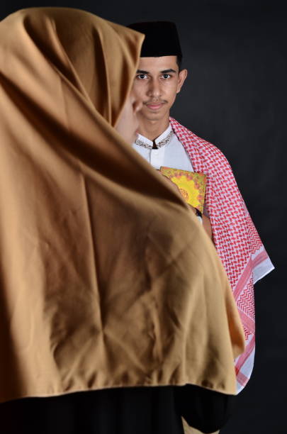 istock Beautiful young muslim couple standing together 991416732