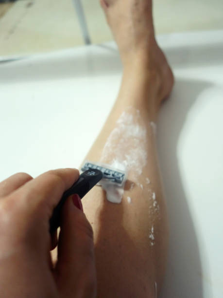 istock lady shaving foot care 991421072