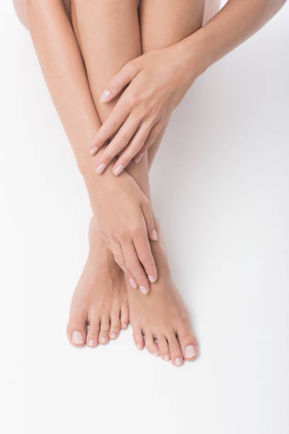 Beautiful legs and hands isolated on white background.