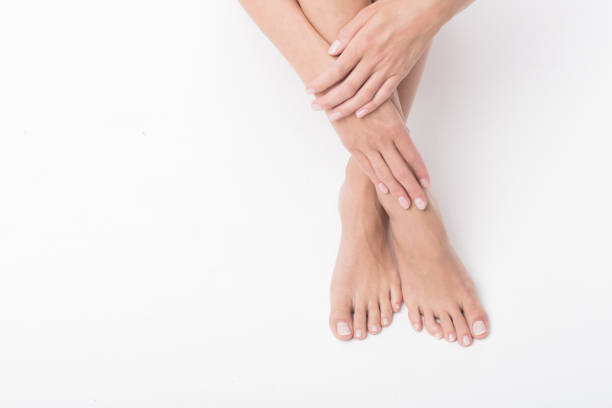istock Beautiful legs and hands isolated on white background. 991427714