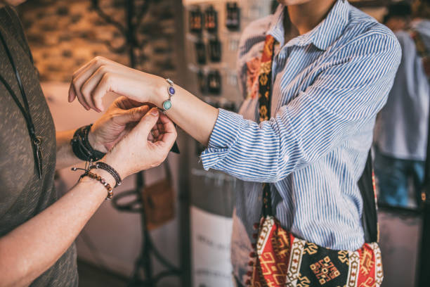 istock Woman trying on a bracelet 991428452