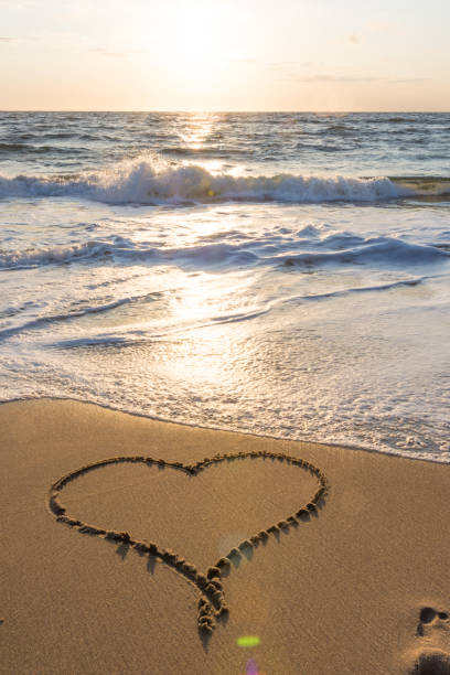 istock Heart in the sand at beach 991438852