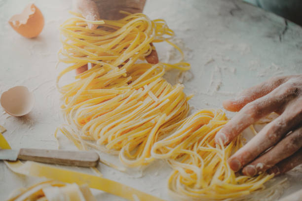 istock Chef making traditional italian homemade pasta 991439060