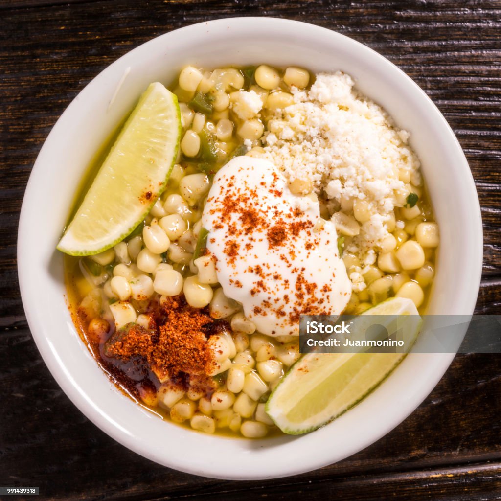Mexican style corn snack (prepared elote) Mexican style corn snack (elote preparado) from above Corn Stock Photo