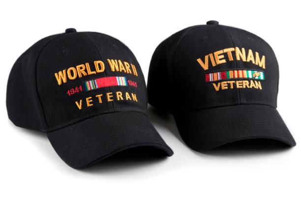 istock World War Two and Vietnam Veteran caps on white background 991439560