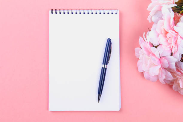 istock Empty notebook with blue pen on a pink pastel background. mock-up, frame, template. 991439826