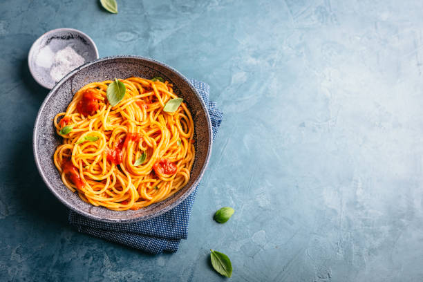 istock Italian pasta with tomato sauce in bowl 991440548