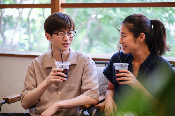 Asian young couple dating at cafe