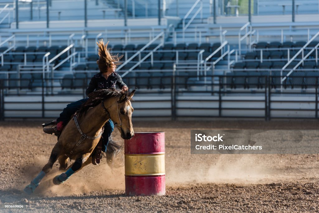 Cowgirl Moving At Speed Around Barrel Racing At Rodeo Hair Flying Stock  Photo - Download Image Now - iStock